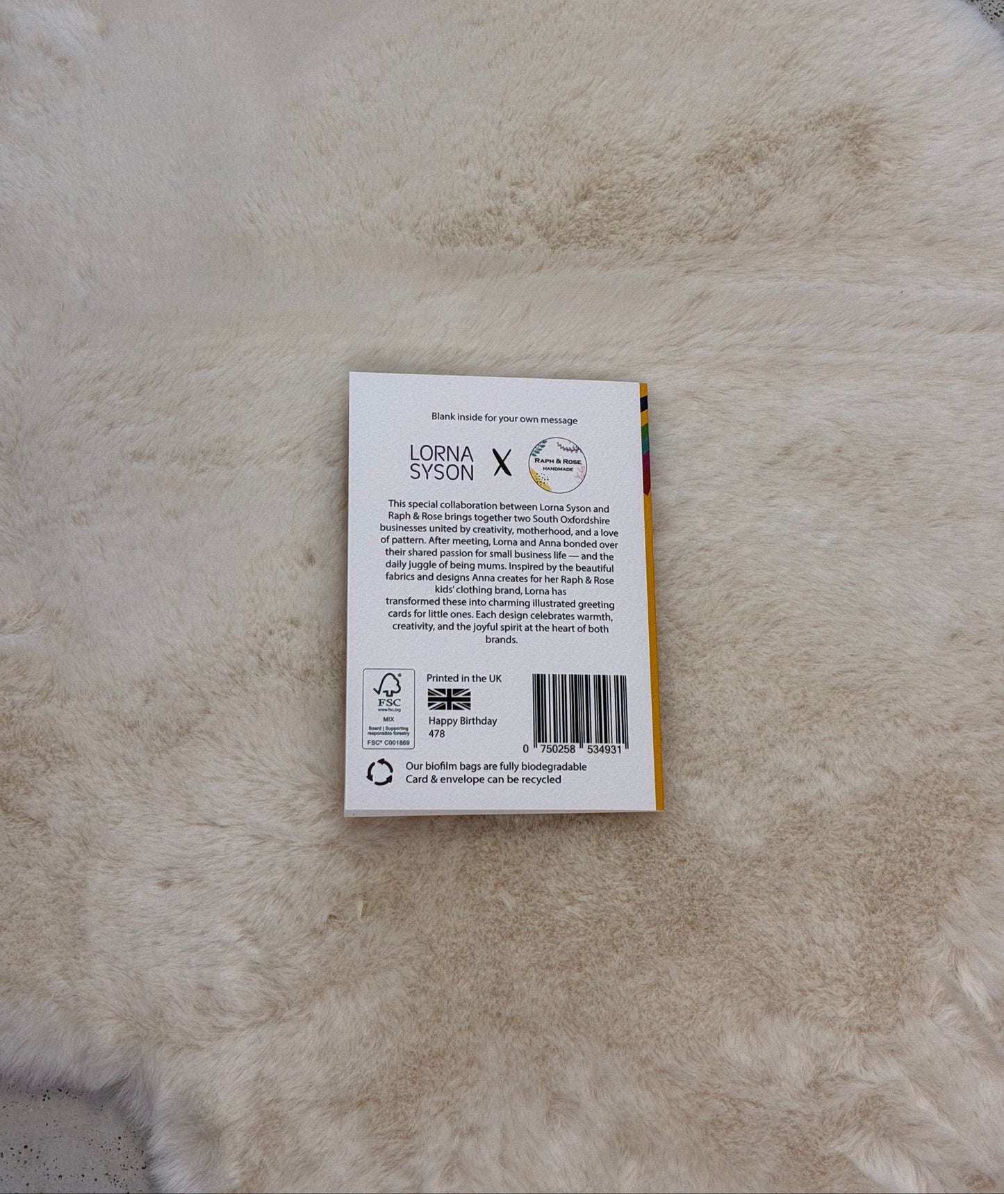 back of greetings card with a label on a textured surface